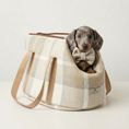 Load image into Gallery viewer, Dog in a plaid pet carrier with a bow tie on a white background