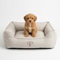 Load image into Gallery viewer, Taupe Heritage Stripe box dog bed with embroidered PP monogram and puppy sitting inside