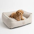 Load image into Gallery viewer, Three-quarter view of Taupe Heritage Stripe box dog bed with puppy resting on the cushion