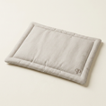 Load image into Gallery viewer, A rectangular dog crate cushion with a light Taupe and white stripe pattern, featuring a small embroidered PP monogram logo in the bottom right corner, set against a warm off-white background.
