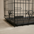 Load image into Gallery viewer, close up image of the posh poos metal brand plate on a black wire dog crate
