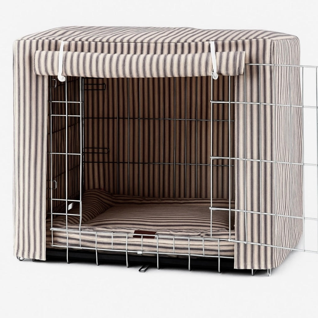 Dog crate with striped cover on a white background by posh poos