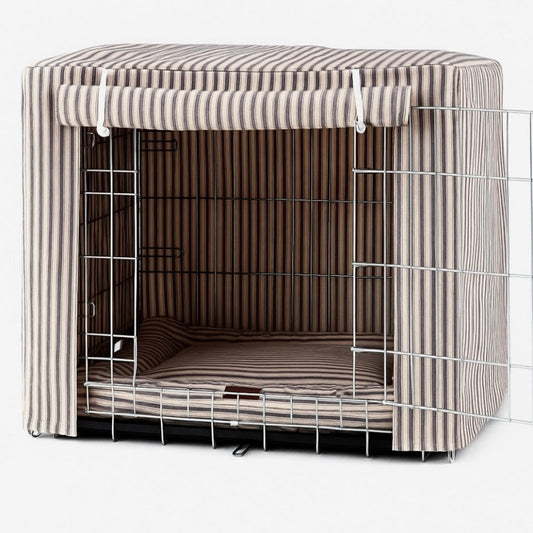 Dog crate with striped cover on a white background by posh poos