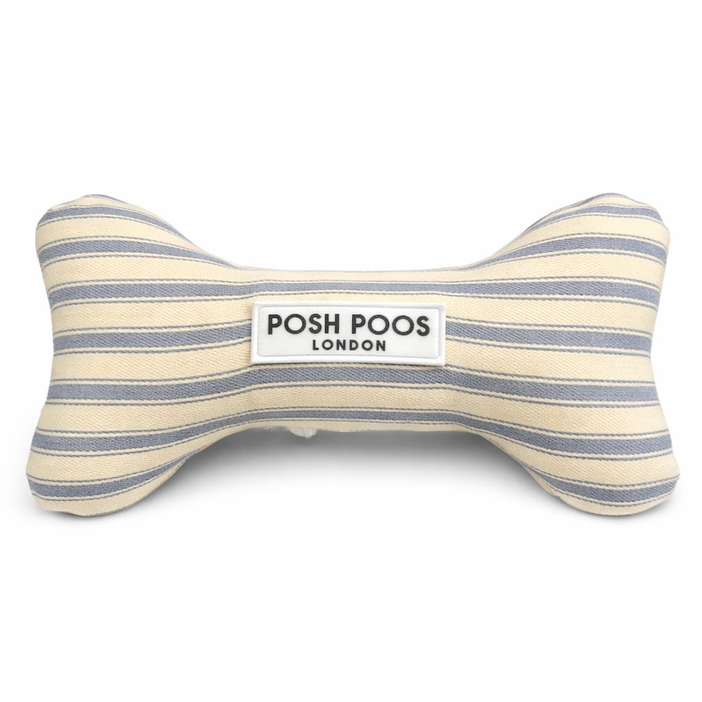 Striped bone-shaped dog toy with 'Posh Poos London' label on a white background