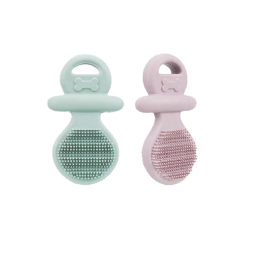 Two silicone puppy teething toys, one green and one pink, on a white background.