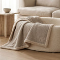 Load image into Gallery viewer, neutral boucle blanket draped over a cream colour dog bed in neutral living room setting 
