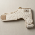 Load image into Gallery viewer, cream boucle fabric dog coat harness with posh poos woven label on a natural fabric background 
