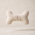 Load image into Gallery viewer, cream boucle fabric go bone toy with embroidery pp monogram on a ivory limewash studio background 
