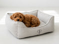 Load image into Gallery viewer, Puppy curled up in Grey Heritage Stripe box dog bed, three-quarter view
